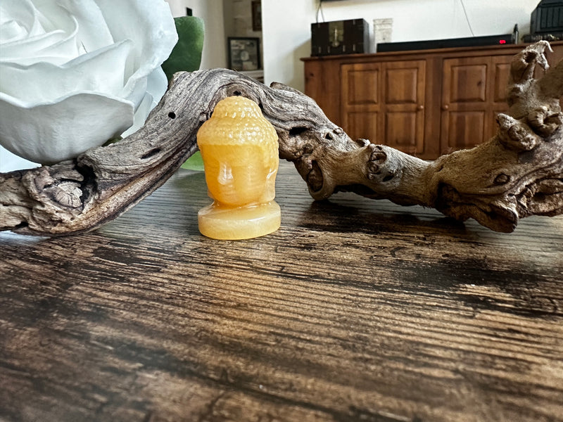 Buddha carved from Orange Calcite FB2816