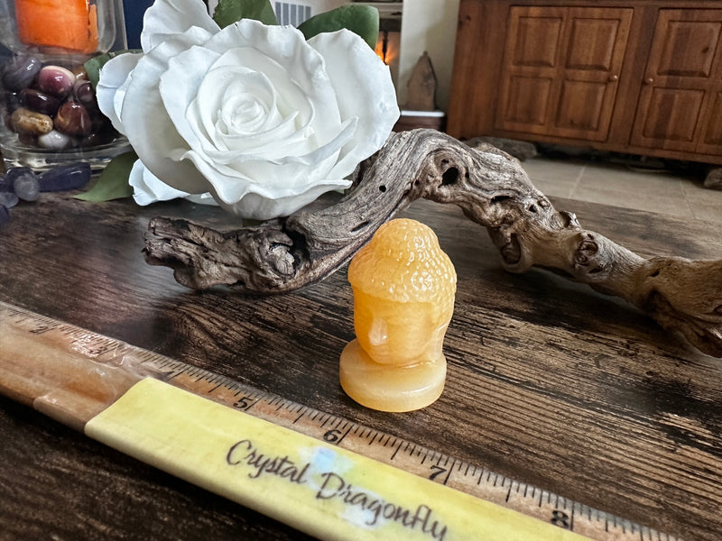 Buddha carved from Orange Calcite FB2816